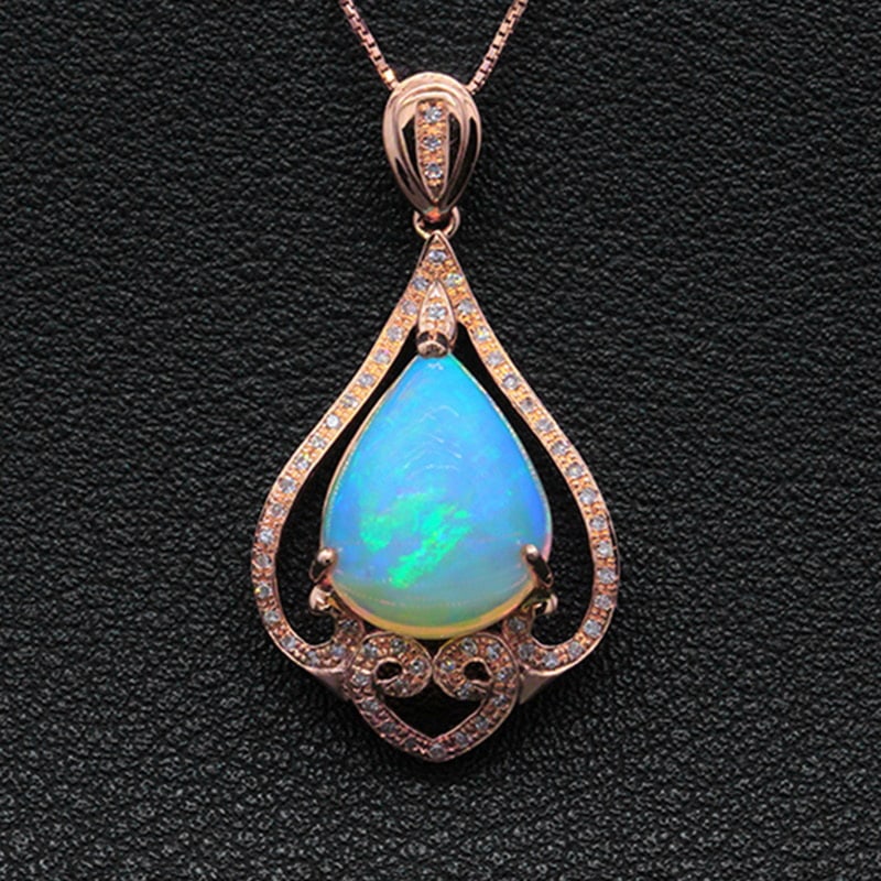 14k Gold 5.13 Ctw Natural Opal & Diamond Pendant( Without Chain ): Ref:231030007 // gold content:14k gold // main gemstone:opal // shape:pear // carat weight:4. 95ct // color:color // treatment:natural // // adjacent gemstone 2 : diamond // shape:round // carat