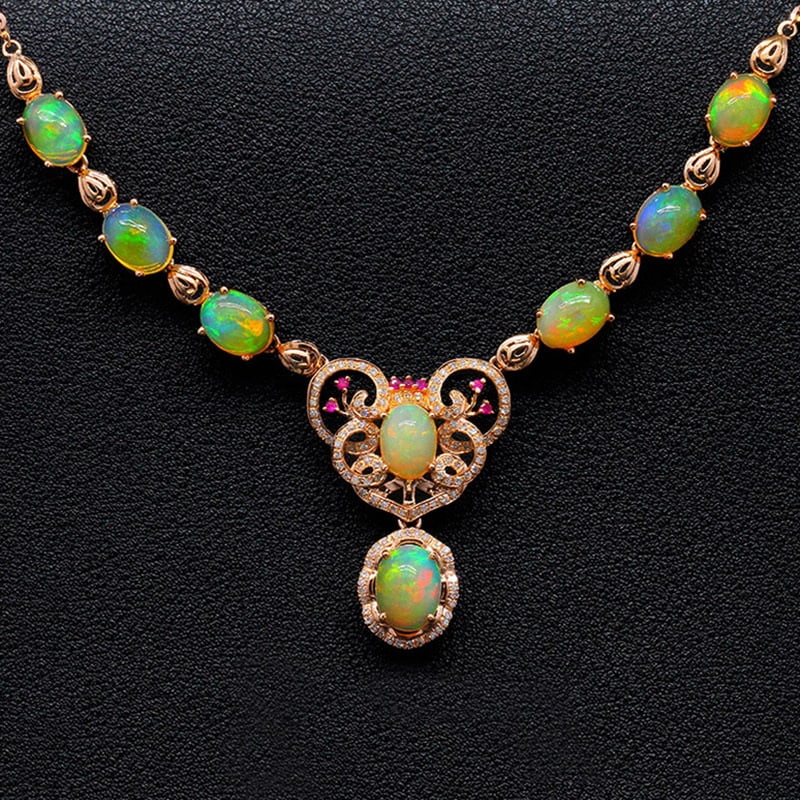14k Gold 9.12 Ctw Natural Opal & Diamond Necklace: Ref:231030009 // gold content:14k gold // main gemstone:opal // shape:oval // carat weight:8. 75ct // color:color // treatment:natural // // adjacent gemstone 2 : diamond // shape:round // carat