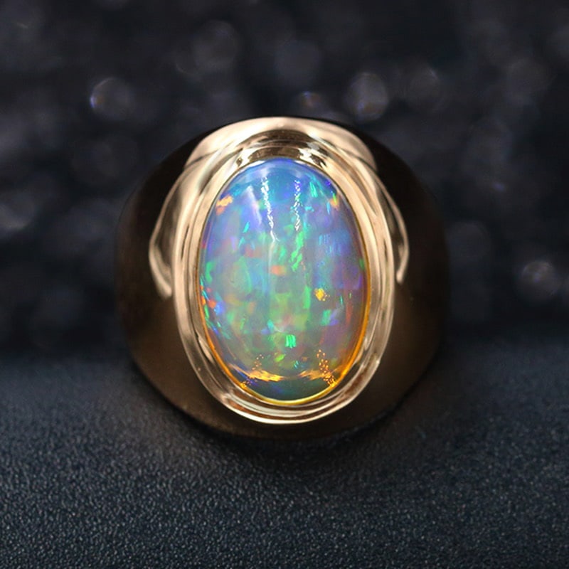 14k Gold 5.5 Ct Natural Opal Ring: Ref:231030012 // gold content:14k gold // ring size:7. 25us // // main gemstone:opal // shape:oval // carat weight:5. 5ct // color:color // treatment:natural // High Estimate: 3300 Condition: New Low