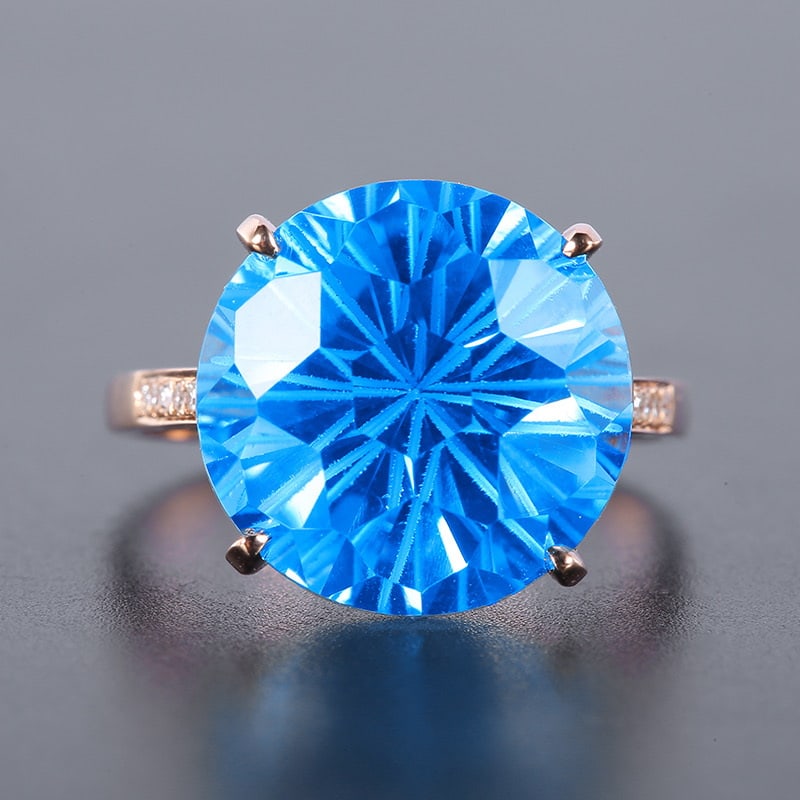 14k Gold 12.72 Ct Natural Topaz & Diamond Ring: Ref:231030030 // gold content:14k gold // ring size:7. 25us // // main gemstone:topaz // shape:round // carat weight:12. 72ct // color:blue // treatment:natural // cut grade:g // // adjacent gemstone