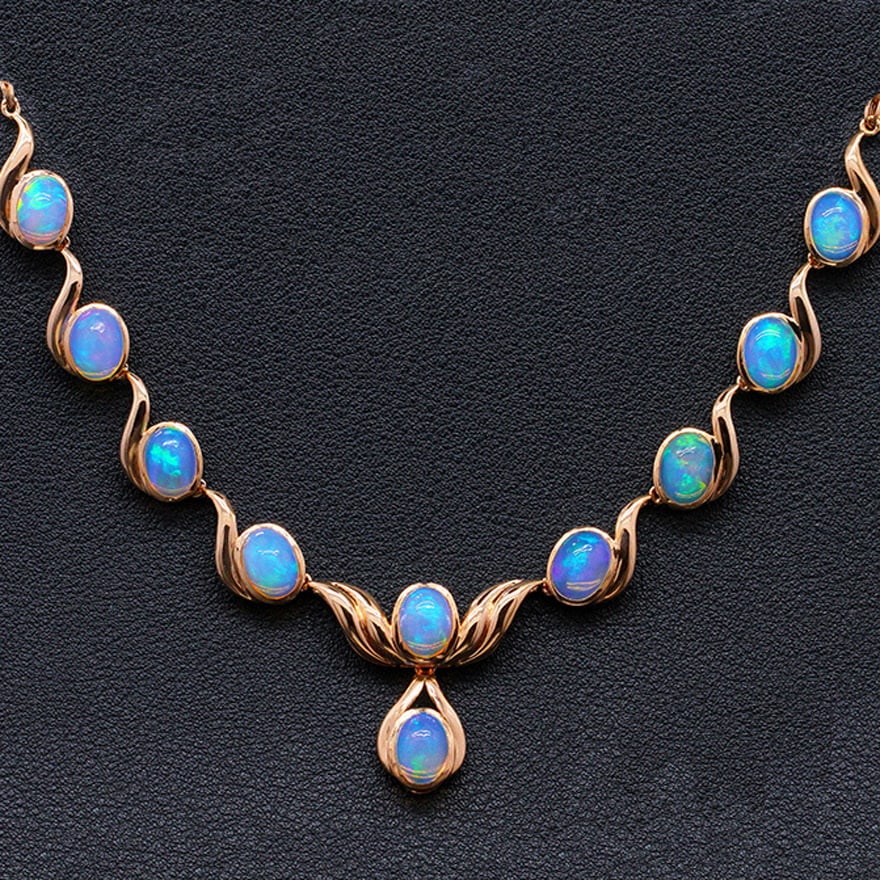 14k Gold 9.58 Ct Natural Opal Necklace: Ref:231030061 // gold content:14k gold // main gemstone:opal // shape:oval // carat weight:9. 58ct // color:color // treatment:natural // High Estimate: 7900 Condition: New Low Estimate: 5300
