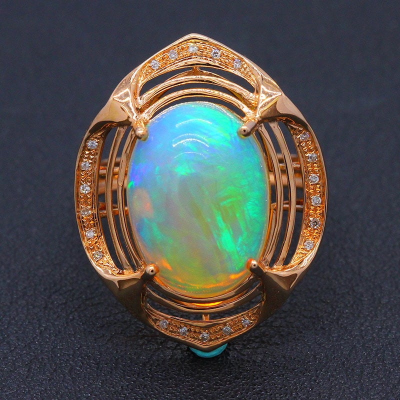 14k Gold 5.62 Ctw Natural Opal & Diamond Ring: Ref:231030066 // gold content:14k gold // ring size:7. 25us // // main gemstone:opal // shape:oval // carat weight:5. 55ct // color:color // treatment:natural // // adjacent gemstone 2 : diamond //