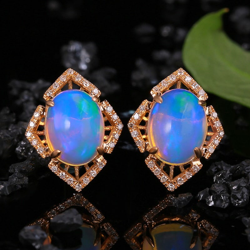 14k Gold 3.09 Ctw Natural Opal & Diamond Earrings: Ref:231030067 // gold content:14k gold // main gemstone:opal // shape:oval // carat weight:2. 95ct // color:color // treatment:natural // // adjacent gemstone 2 : diamond // shape:round // carat
