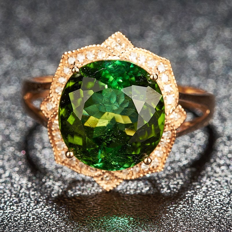 14k Gold 5.15 Ct Natural Tourmaline & Diamond Ring: Ref:231030093 // gold content:14k gold // ring size:7. 25us // // main gemstone:tourmaline // shape:oval // carat weight:5. 15ct // color:green // treatment:natural // // adjacent gemstone 2 :