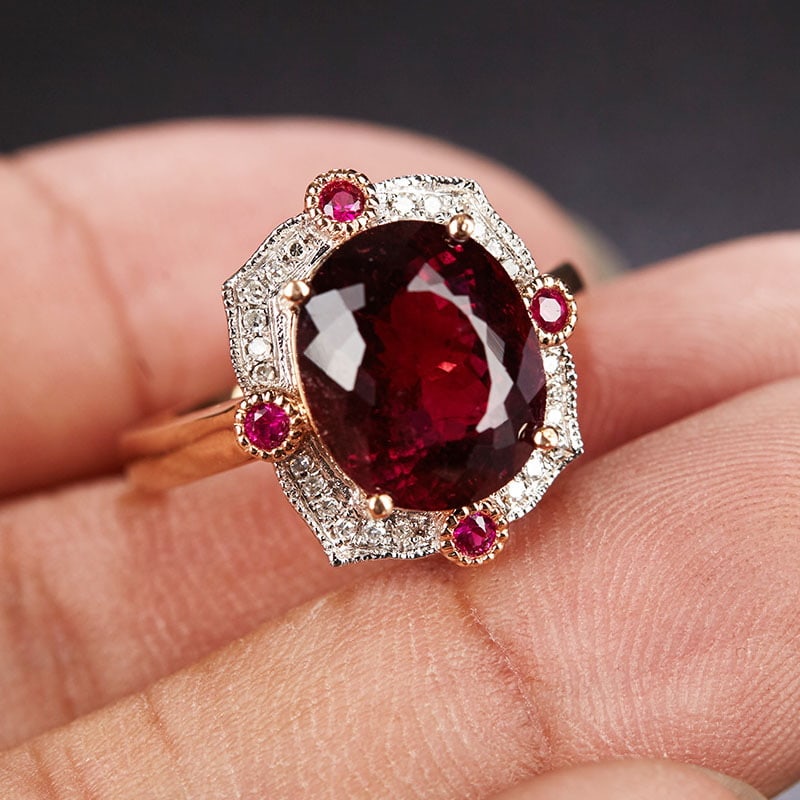 14k Gold 5.1 Ct Natural Tourmaline & Diamond & Ruby Ring: Ref:231030094 // gold content:14k gold // ring size:7. 25us // // main gemstone:tourmaline // shape:oval // carat weight:5. 1ct // color:red // treatment:natural // // adjacent gemstone 2 : diamond