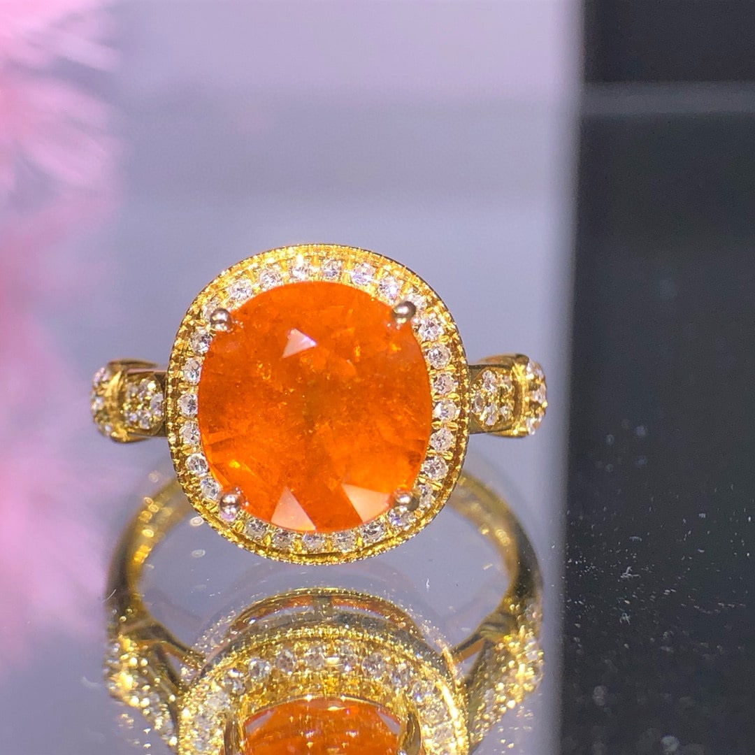 14k Gold 5.35 Ct Natural Spessartine & Diamond Ring: Ref:231030129 // gold content:14k gold // ring size:7. 25us // // main gemstone:spessartine // shape:oval // carat weight:5. 35ct // color:orange // treatment:natural // // adjacent gemstone 2 :