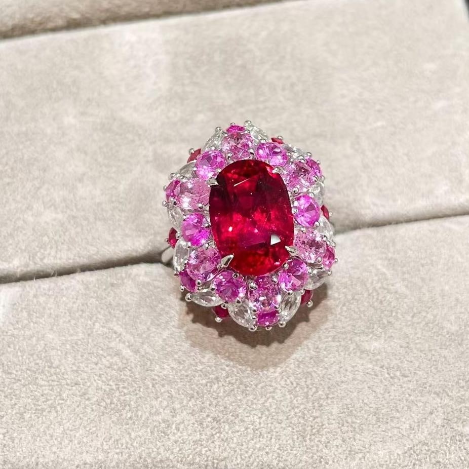 14k Gold 8.47 Ctw Natural Tourmaline & Sapphire Ring: Ref:231030135 // gold content:14k gold // ring size:7. 25us // // main gemstone:tourmaline // shape:oval // carat weight:3. 92ct // color:red // treatment:natural // // adjacent gemstone 2 : sapphire