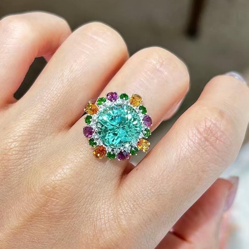 14k Gold 11.39 Ctw Natural Tourmaline & Gem Ring: Ref:231030138 // gold content:14k gold // ring size:7. 25us // // main gemstone:tourmaline // shape:round // carat weight:9. 1ct // color:green // treatment:natural // cut grade:g // // adjacent gemst