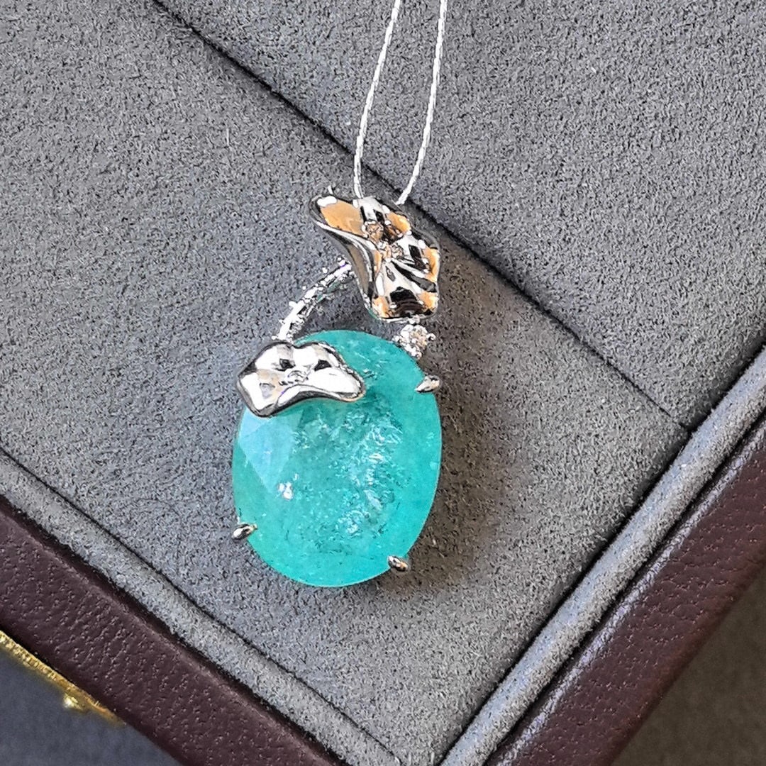 14k Gold 6.52 Ct Natural Paraiba Tourmaline & Diamond Pendant( Without Chain ): Ref:231030140 // gold content:14k gold // main gemstone:paraiba tourmaline // shape:oval // carat weight:6. 52ct // color:blue // treatment:natural // // adjacent gemstone 2 : diamond // shape:round