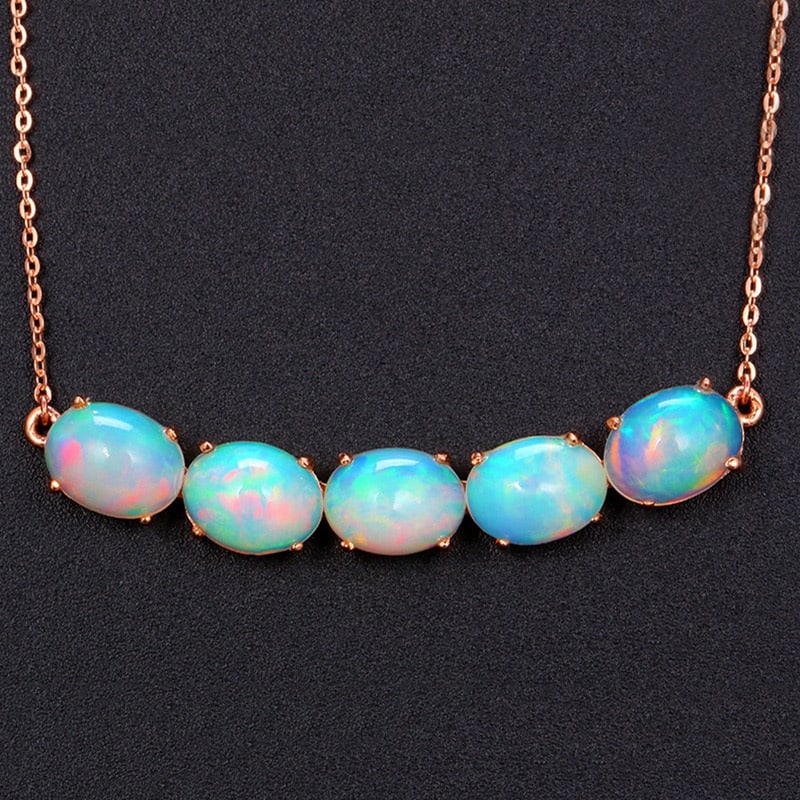 14k Gold 4.36 Ct Natural Opal Necklace: Ref:231030152 // gold content:14k gold // main gemstone:opal // shape:oval // carat weight:4. 36ct // color:color // treatment:natural // Condition: New High Estimate: 2800 Low Estimate: 1900