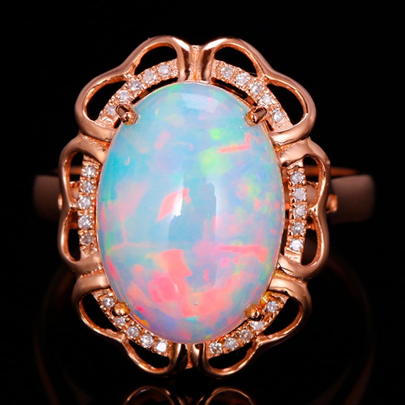 14k Gold 3.79 Ctw Natural Opal & Diamond Ring: Ref:231030159 // gold content:14k gold // ring size:7. 25us // // main gemstone:opal // shape:oval // carat weight:3. 7ct // color:color // treatment:natural // // adjacent gemstone 2 : diamond //