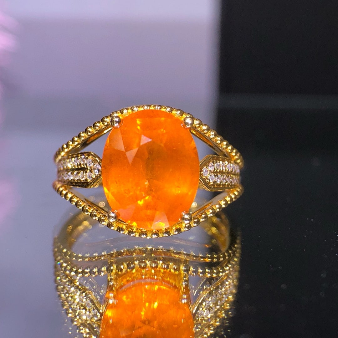 14k Gold 4.85 Ct Natural Spessartine & Diamond Ring: Ref:231030199 // gold content:14k gold // ring size:7. 25us // // main gemstone:spessartine // shape:oval // carat weight:4. 85ct // color:orange // treatment:natural // // adjacent gemstone 2 :