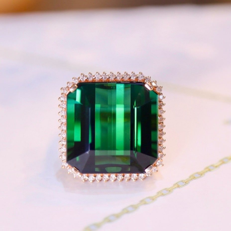 14k Gold 24.38 Ct Natural Tourmaline & Diamond Ring: Ref:231030201 // gold content:14k gold // ring size:7. 25us // // main gemstone:tourmaline // shape:octagonal // carat weight:24. 38ct // color:green // treatment:natural // // adjacent gemstone 2 :