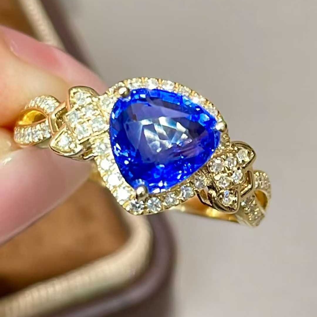 14k Gold 2.32 Ct Natural Sapphire & Diamond Ring: Ref:231030234 // gold content:14k gold // ring size:7. 25us // // main gemstone:sapphire // shape:pear // carat weight:2. 32ct // color:cornflower blue // treatment:natural // // adjacent gemstone 2