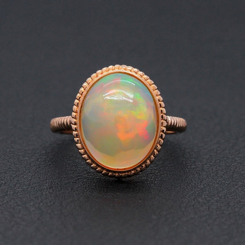 14k Gold 4.00 Ct Natural Opal Ring: Ref:231030253 // gold content:14k gold // ring size:7. 25us // // main gemstone:opal // shape:oval // carat weight:4. 00ct // color:color // treatment:natural // High Estimate: 3300 Low Estimate: 2200