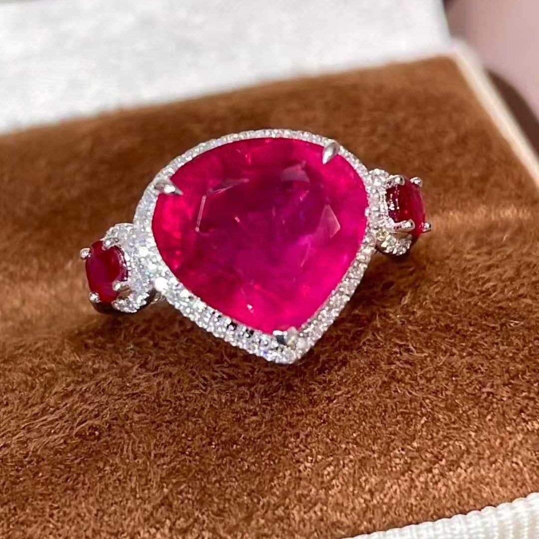 14k Gold 4.71 Ctw Natural Tourmaline & Ruby Ring: Ref:231030255 // gold content:14k gold // ring size:7. 25us // // main gemstone:tourmaline // shape:pear // carat weight:4. 33ct // color:red // treatment:natural // // adjacent gemstone 2 : ruby //