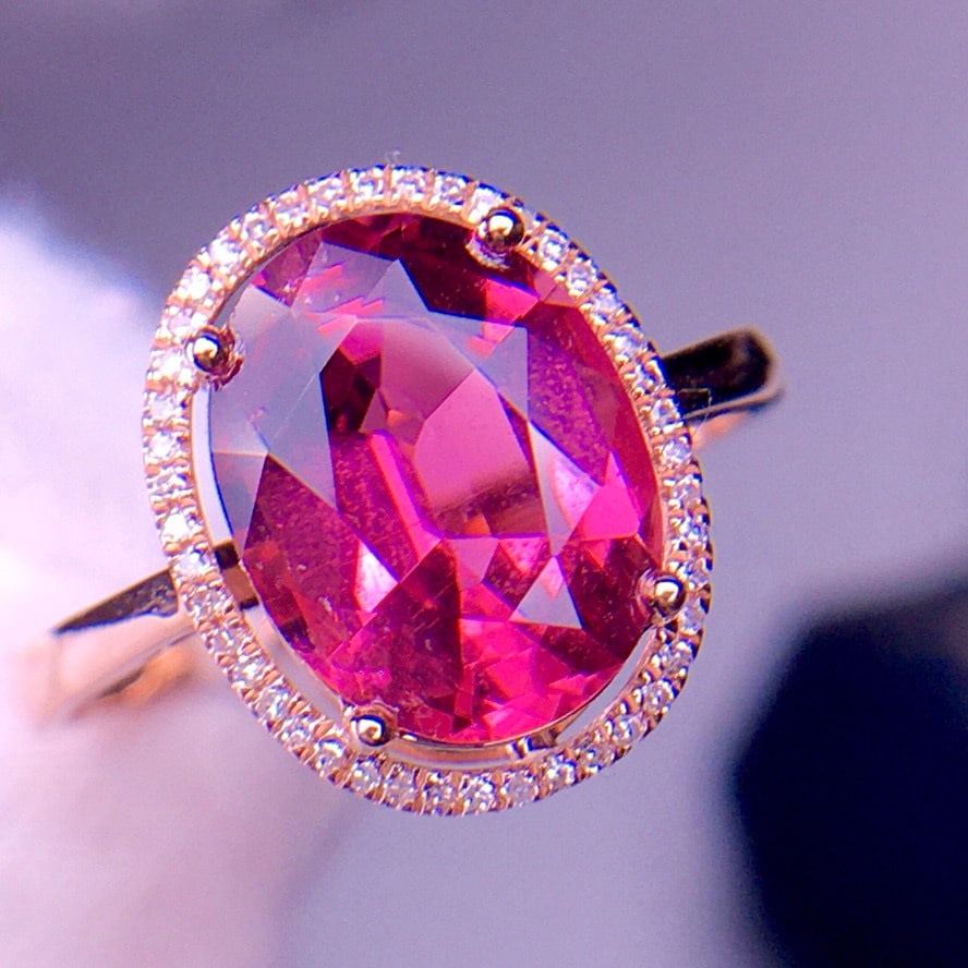 14k Gold 3.4 Ct Natural Tourmaline & Diamond Ring: Ref:231030257 // gold content:14k gold // ring size:7. 25us // // main gemstone:tourmaline // shape:oval // carat weight:3. 4ct // color:red // treatment:natural // // adjacent gemstone 2 : diamond