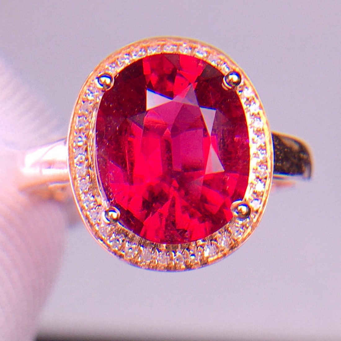 14k Gold 3.2 Ct Natural Tourmaline & Diamond Ring: Ref:231030259 // gold content:14k gold // ring size:7. 25us // // main gemstone:tourmaline // shape:oval // carat weight:3. 2ct // color:red // treatment:natural // // adjacent gemstone 2 : diamond //