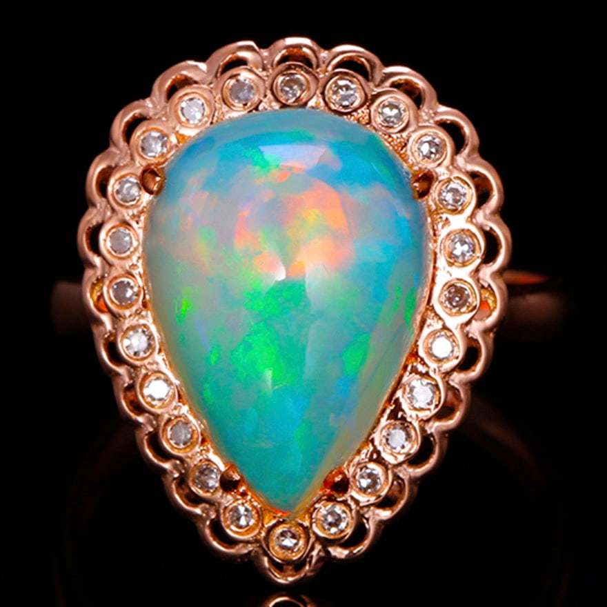 14k Gold 4.22 Ctw Natural Opal & Diamond Ring: Ref:231030335 // gold content:14k gold // ring size:7. 25us // // main gemstone:opal // shape:pear // carat weight:4. 10ct // color:color // treatment:natural // // adjacent gemstone 2 : diamond //