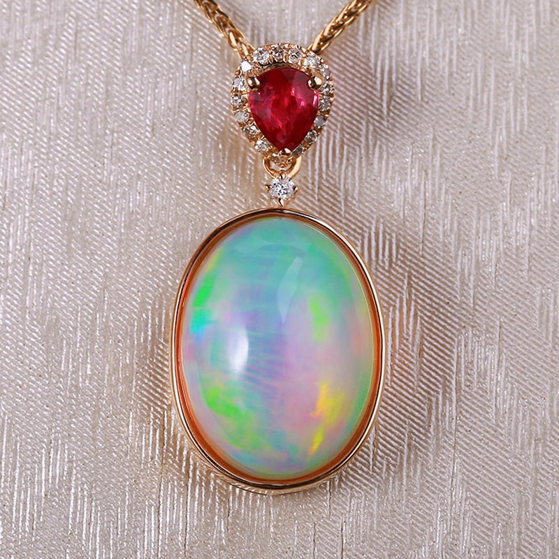 14k Gold 4.79 Ctw Natural Opal & Diamond Pendant( Without Chain ): Ref:231030336 // gold content:14k gold // main gemstone:opal // shape:oval // carat weight:4. 73ct // color:color // treatment:natural // // adjacent gemstone 2 : diamond // shape:round // carat