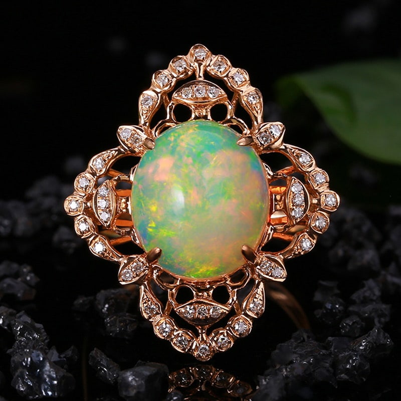 14k Gold 4.78 Ctw Natural Opal & Diamond Ring: Ref:231030338 // gold content:14k gold // ring size:7. 25us // // main gemstone:opal // shape:oval // carat weight:4. 56ct // color:color // treatment:natural // // adjacent gemstone 2 : diamond //