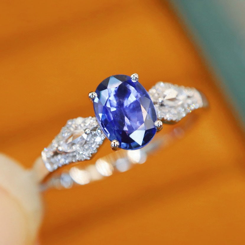 14k Gold 0.97 Ctw Natural Sapphire & Diamond Ring: Ref:231030368 // gold content:14k gold // ring size:7. 25us // // main gemstone:sapphire // shape:oval // carat weight:0. 86ct // color:cornflower blue // treatment:natural // // adjacent gemstone 2
