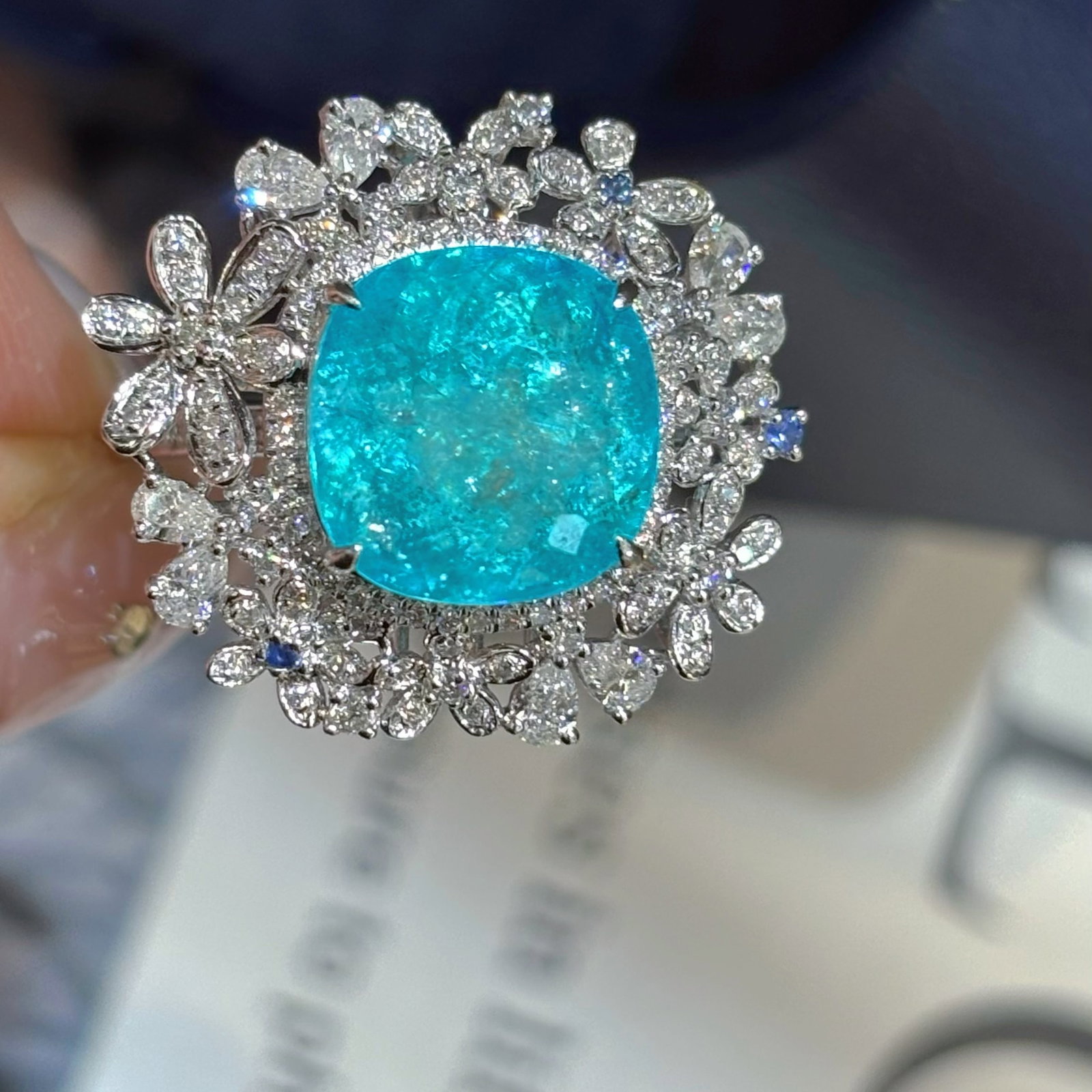 14k Gold 8.2 Ctw Natural Paraiba Tourmaline & Diamond Ring: Ref:231030419 // gold content:14k gold // ring size:7. 25us // // main gemstone:paraiba tourmaline // shape:cushion // carat weight:7ct // color:blue // treatment:natural // // adjacent gemstone 2 :