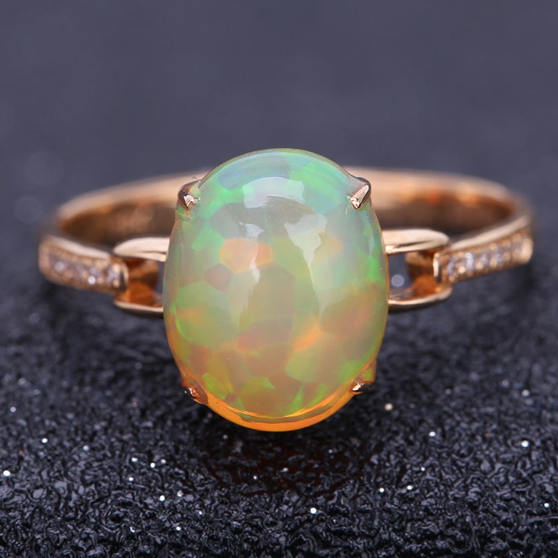 14k Gold 2 Ct Natural Opal & Diamond Ring: Ref:231030443 // gold content:14k gold // ring size:7. 25us // // main gemstone:opal // shape:oval // carat weight:2ct // color:color // treatment:natural // // adjacent gemstone 2 : diamond //