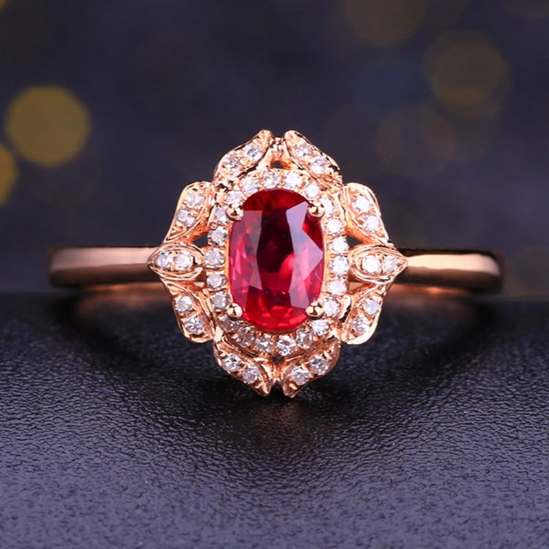 14k Gold 0.74 Ctw Natural Ruby & Diamond Ring: Ref:231031032 // gold content:14k gold // ring size:7. 25us // // main gemstone:ruby // shape:oval // carat weight:0. 62ct // color:red // treatment:natural // // adjacent gemstone 2 : diamond //