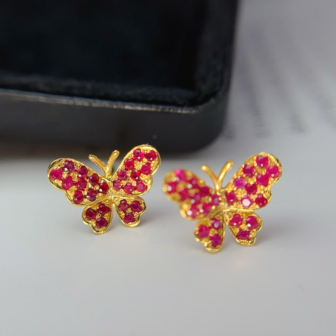14k Gold 1.00 Ct Natural Ruby & Butterfly Earrings: Ref:231031045 // gold content:14k gold // main gemstone:ruby // shape:round // carat weight:1. 00ct // color:red // treatment:natural // cut grade:g // Condition: New Low Estimate: 1400.00 High Estima