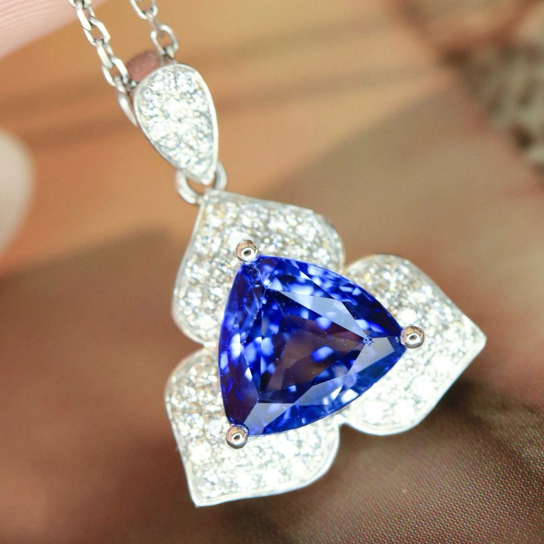 14k Gold 1.82 Ctw Natural Tanzanite & Diamond Pendant( Without Chain ): Ref:231031099 // gold content:14k gold // main gemstone:tanzanite // shape:triangle // carat weight:1. 62ct // color:blue // treatment:natural // // adjacent gemstone 2 : diamond // shape:round //
