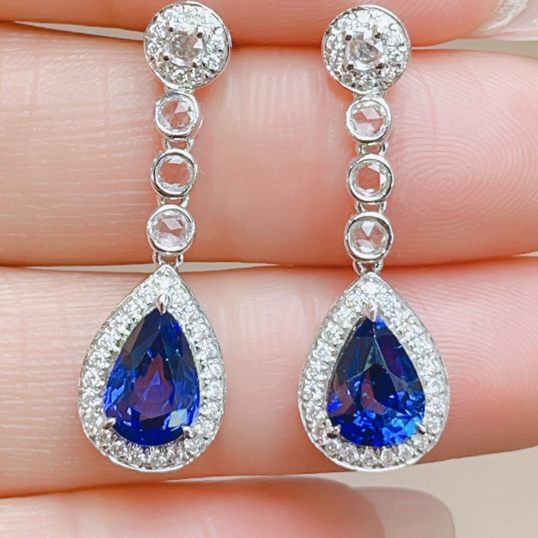 14k Gold 3.11 Ctw Natural Sapphire & Diamond Earrings: Ref:231031104 // gold content:14k gold // main gemstone:sapphire // shape:pear // carat weight:2. 8ct // color:royal blue // treatment:natural // // adjacent gemstone 2 : diamond // shape:round // car