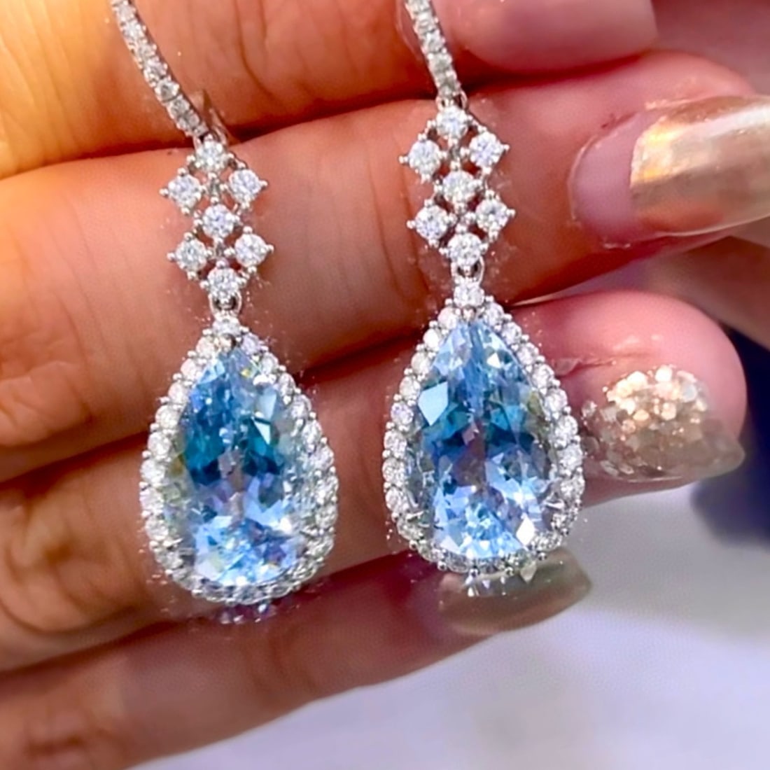 14k Gold 10.40 Ctw Natural Aquamarine & Diamond Earrings: Ref:231031107 // gold content:14k gold // main gemstone:aquamarine // shape:pear // carat weight:9. 00ct // color:santa maria color // treatment:natural // // adjacent gemstone 2 : diamond // shape:ro