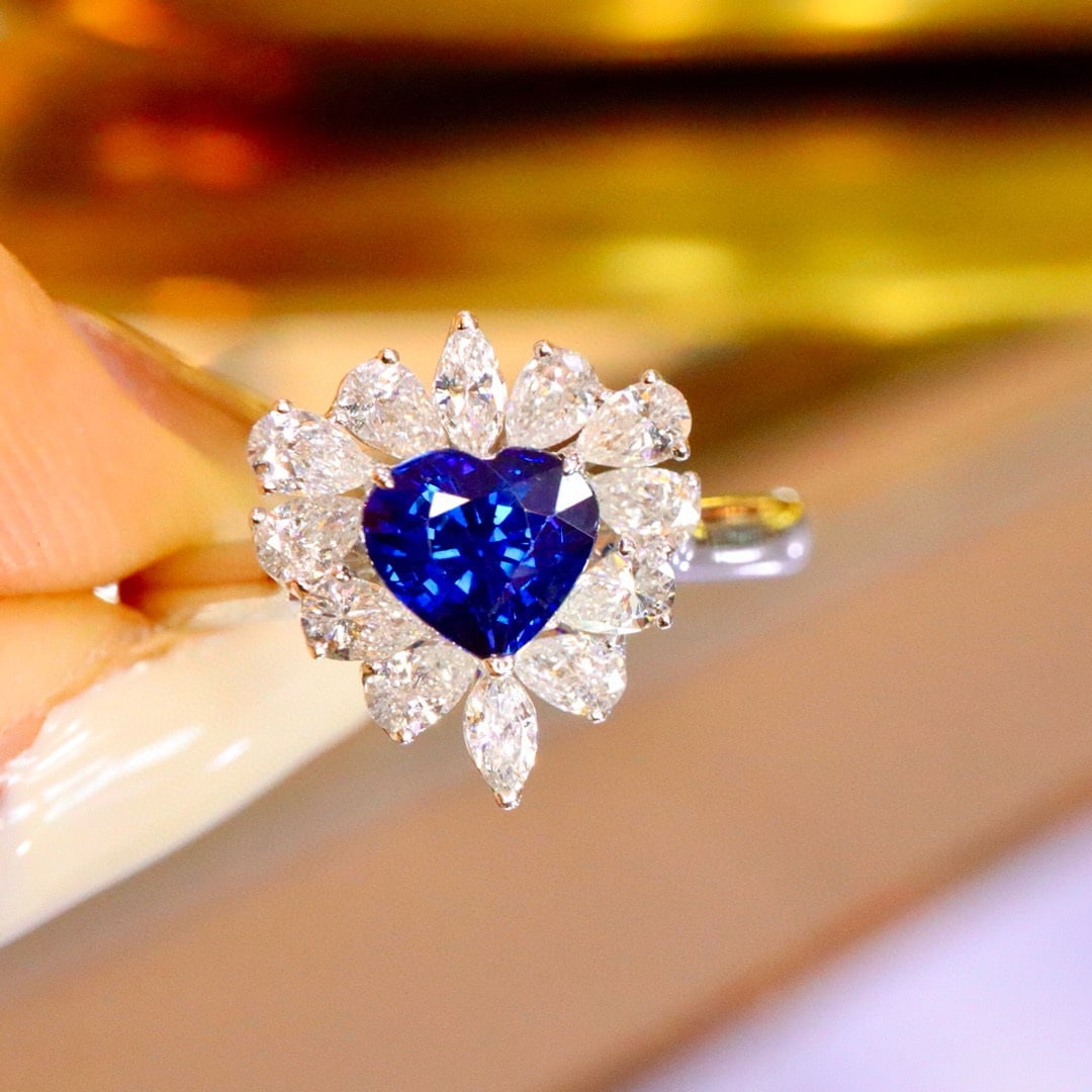 14k Gold 1.48 Ctw Natural Sapphire & Diamond Ring: Ref:231031116 // gold content:14k gold // ring size:7. 25us // // main gemstone:sapphire // shape:heart // carat weight:0. 90ct // color:blue // treatment:natural // // adjacent gemstone 2 : diamond