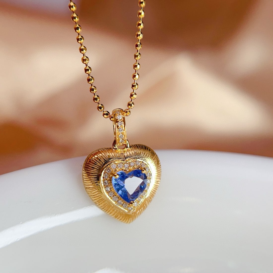 14k Gold 0.58 Ct Natural Sapphire & Diamond Pendant( Without Chain ): Ref:231031217 // gold content:14k gold // main gemstone:sapphire // shape:heart // carat weight:0. 58ct // color:blue // treatment:natural // // adjacent gemstone 2 : diamond // shape:round //