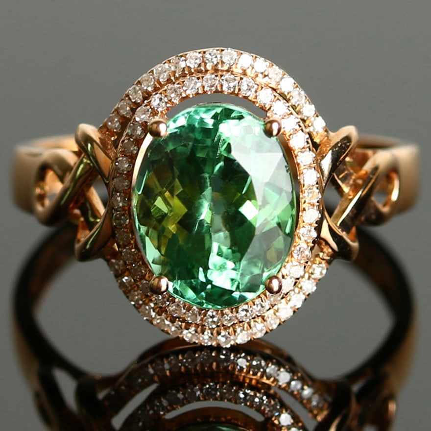 14k Gold 2.9 Ct Natural Tourmaline & Diamond Ring: Ref:231032004 // gold content:14k gold // ring size:7. 25us // // main gemstone:tourmaline // shape:oval // carat weight:2. 9ct // color:green // treatment:natural // // adjacent gemstone 2 : diamond