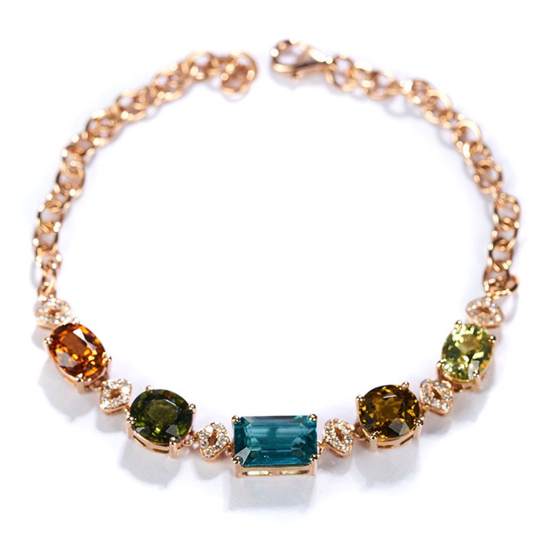 14k Gold 6.7 Ct Natural Tourmaline & Diamond Bracelet: Ref:231032008 // gold content:14k gold // main gemstone:tourmaline // shape:multiply // carat weight:6. 7ct // color:color // treatment:natural // // adjacent gemstone 2 : diamond // shape:round //