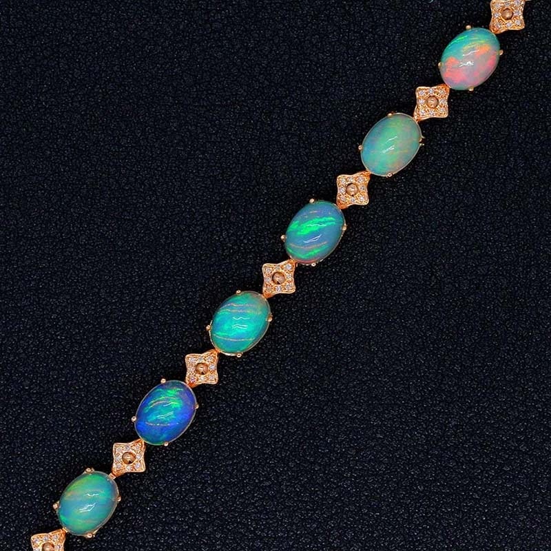 14k Gold 5.71 Ctw Natural Opal & Diamond Bracelet: Ref:231032027 // gold content:14k gold // main gemstone:opal // shape:oval // carat weight:5. 49ct // color:color // treatment:natural // // adjacent gemstone 2 : diamond // shape:round // carat