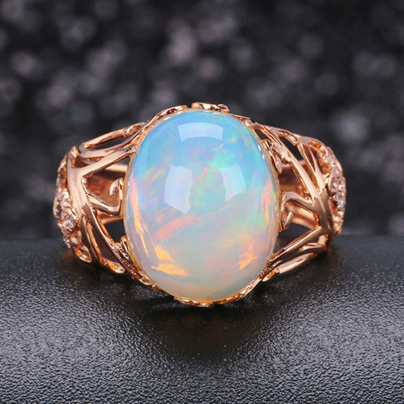 14k Gold 5.37 Ctw Natural Opal & Diamond Ring: Ref:231032029 // gold content:14k gold // ring size:7. 25us // // main gemstone:opal // shape:oval // carat weight:5. 25ct // color:color // treatment:natural // // adjacent gemstone 2 : diamond //
