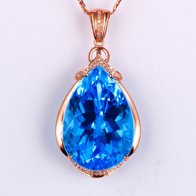 14k Gold 31.11 Ctw Natural Topaz & Diamond Pendant( Without Chain ): Ref:231032039 // gold content:14k gold // main gemstone:topaz // shape:pear // carat weight:31. 00ct // color:blue // treatment:natural // // adjacent gemstone 2 : diamond // shape:round // carat