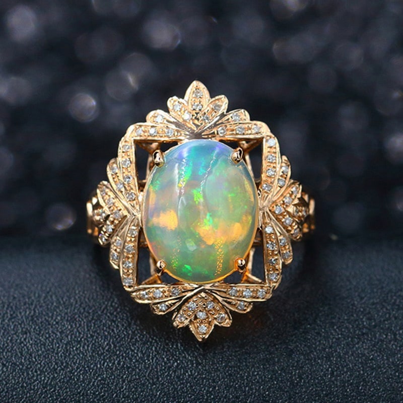 14k Gold 3.40 Ctw Natural Opal & Diamond Ring: Ref:231032079 // gold content:14k gold // ring size:7. 25us // // main gemstone:opal // shape:oval // carat weight:3. 2ct // color:color // treatment:natural // // adjacent gemstone 2 : diamond //