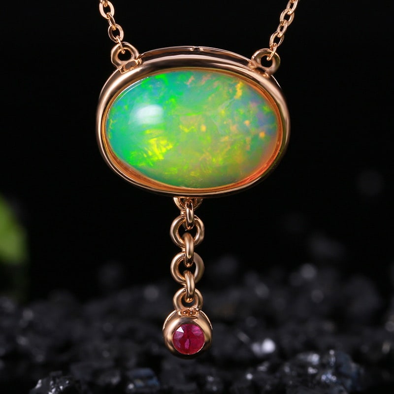 14k Gold 4.23 Ctw Natural Opal & Ruby Necklace: Ref:231032080 // gold content:14k gold // main gemstone:opal // shape:oval // carat weight:4. 13ct // color:color // treatment:natural // // adjacent gemstone 2 : ruby // shape:round // carat