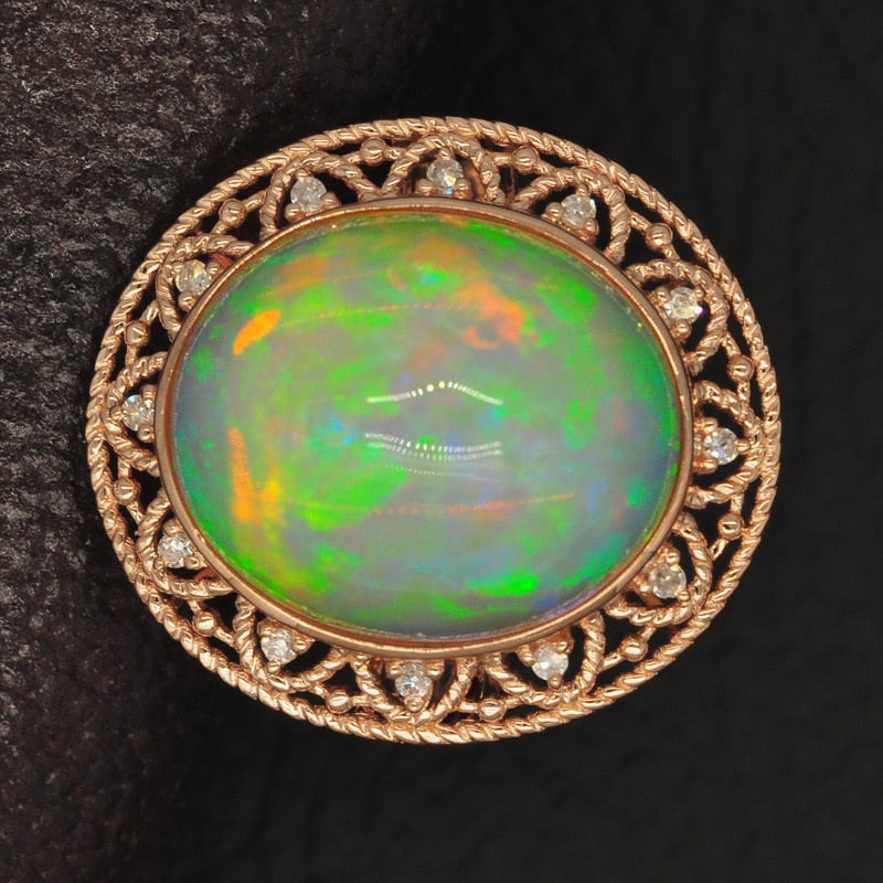 14k Gold 9.16 Ct Natural Opal & Diamond Ring: Ref:231032081 // gold content:14k gold // ring size:7. 25us // // main gemstone:opal // shape:oval // carat weight:9. 16ct // color:color // treatment:natural // // adjacent gemstone 2 : diamond //