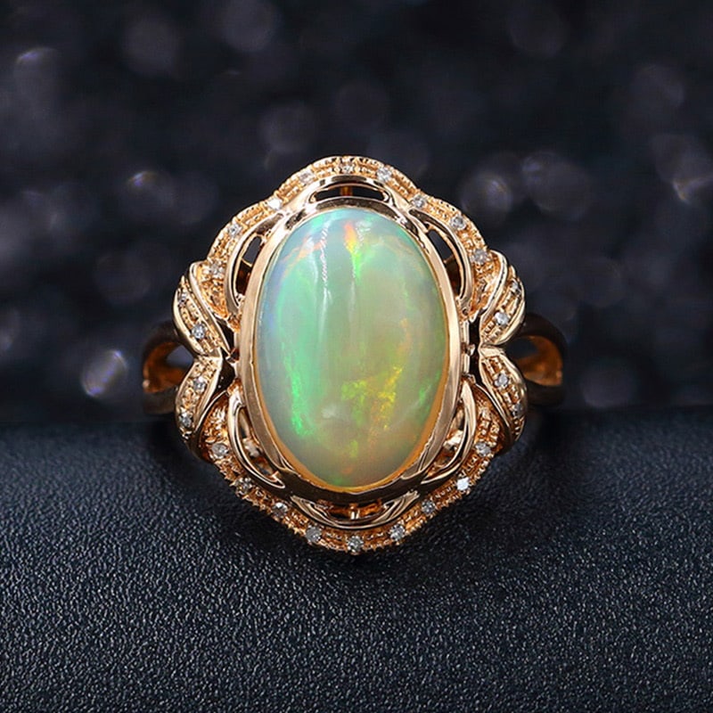 14k Gold 2.65 Ct Natural Opal & Diamond Ring: Ref:231032084 // gold content:14k gold // ring size:7. 25us // // main gemstone:opal // shape:oval // carat weight:2. 65ct // color:color // treatment:natural // // adjacent gemstone 2 : diamond //