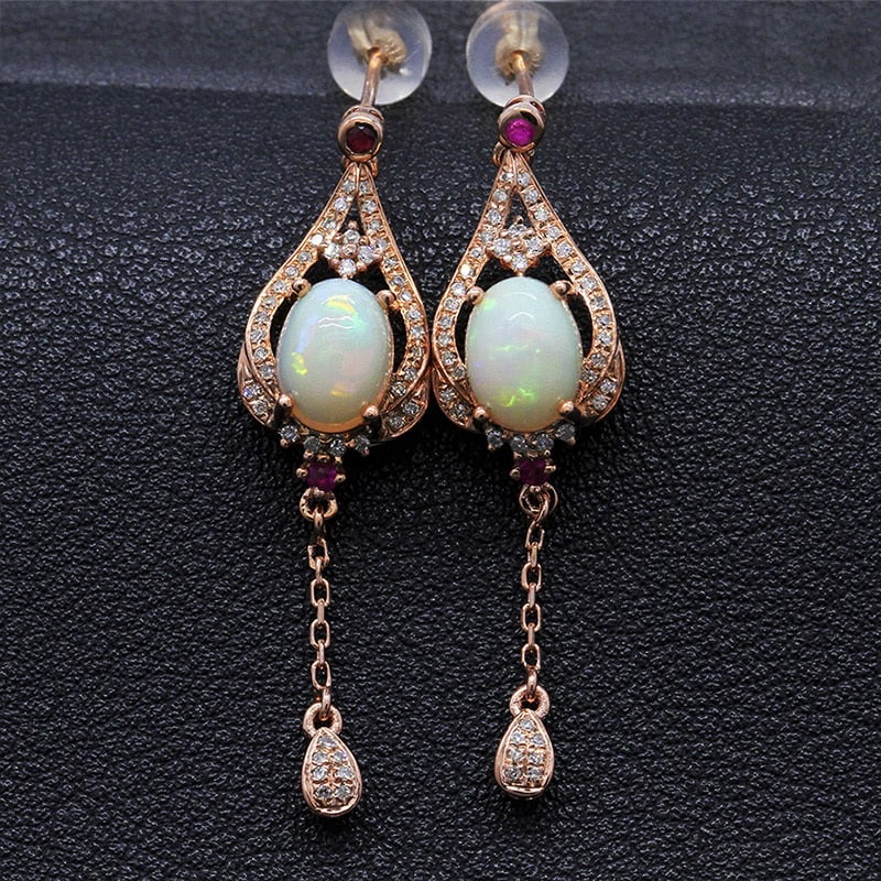 14k Gold 2.04 Ctw Natural Opal & Diamond Earrings: Ref:231032085 // gold content:14k gold // main gemstone:opal // shape:oval // carat weight:1. 72ct // color:color // treatment:natural // // adjacent gemstone 2 : diamond // shape:round // carat weigh