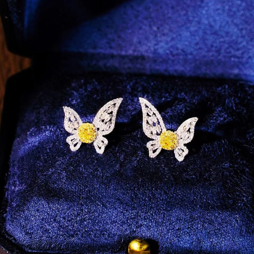 14k Gold 0.86 Ct Natural Color Diamond Earrings: Ref:231032087 // gold content:14k gold // main gemstone:diamond // shape:multiply // carat weight:0. 86ct // clarity grade:vs-si // color:color // treatment:natural // Low Estimate: 3700 Condition: Ne