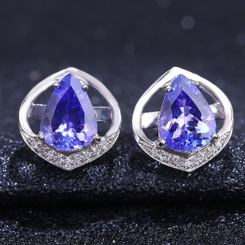 14k Gold 2.96 Ct Natural Tanzanite & Diamond Earrings: Ref:231032098 // gold content:14k gold // main gemstone:tanzanite // shape:pear // carat weight:2. 96ct // color:blue // treatment:natural // // adjacent gemstone 2 : diamond // shape:round //