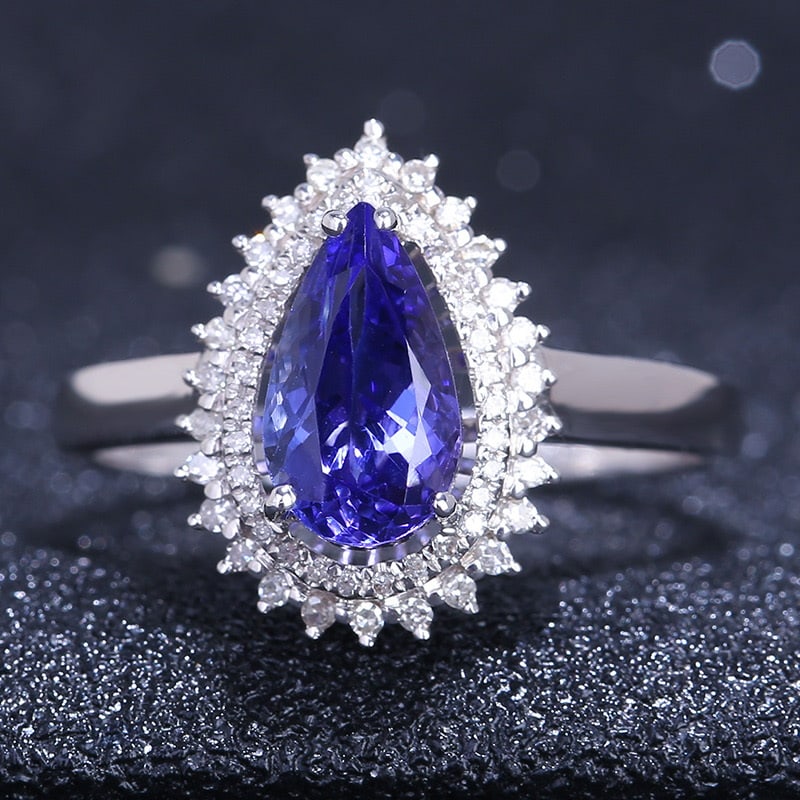 14k Gold 1.4 Ct Natural Tanzanite & Diamond Ring: Ref:231032099 // gold content:14k gold // ring size:7. 25us // // main gemstone:tanzanite // shape:pear // carat weight:1. 4ct // color:blue // treatment:natural // // adjacent gemstone 2 : diamond