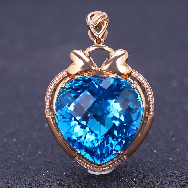 14k Gold 47.35 Ct Natural Topaz & Diamond Pendant( Without Chain ): Ref:231032100 // gold content:14k gold // main gemstone:topaz // shape:heart // carat weight:47. 35ct // color:blue // treatment:natural // // adjacent gemstone 2 : diamond // shape:round // clarity