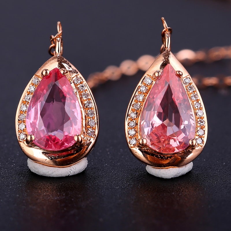 14k Gold 2.35 Ct Natural Sapphire & Diamond Earrings: Ref:231032109 // gold content:14k gold // main gemstone:sapphire // shape:pear // carat weight:2. 35ct // color:pink // treatment:natural // // adjacent gemstone 2 : diamond // shape:round // clarity